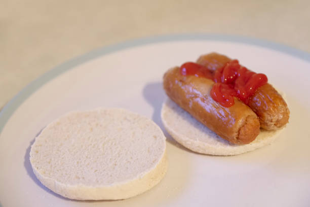 istock sausage muffin breakfast roll on plate with tomato sauce 1131643926