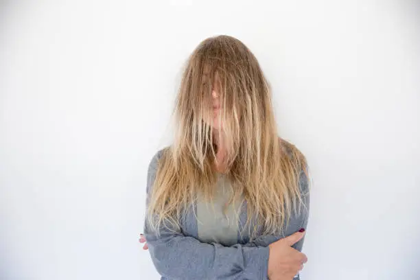 Photo of Mature Woman With Long Hair Covering Her Face