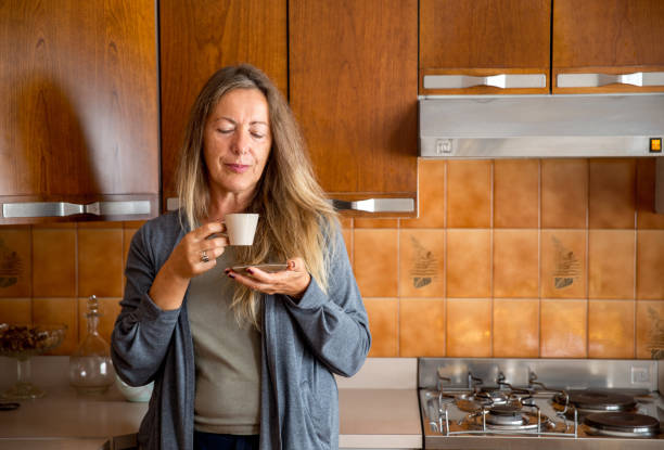 istock Mature Woman Drinking Coffee at Home 1131651330