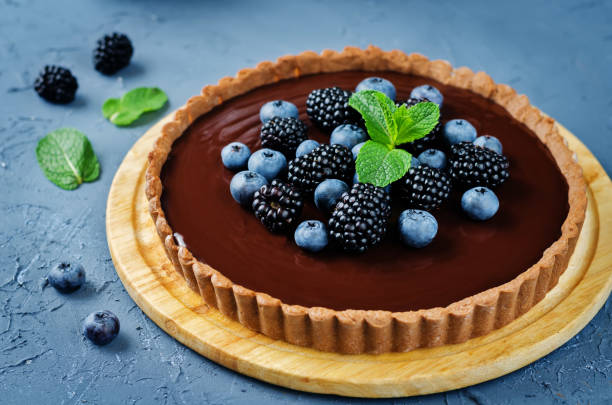 istock Chocolate tart with blackberries and blueberries 1131652339
