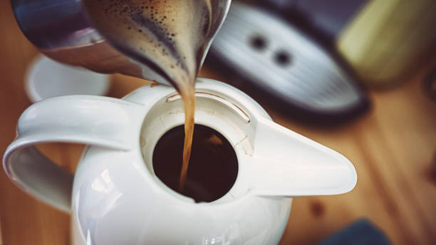 istock Fresh coffee is filled in a thermos 1131652346