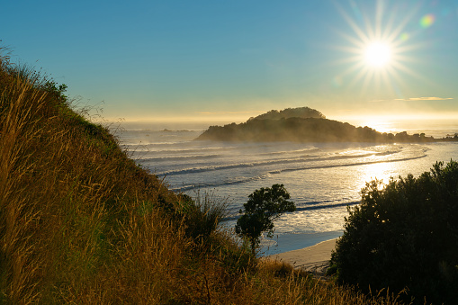 View from side Mount Maunganui overlooking Main Beach and out to sea