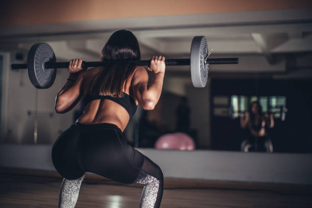 istock Woman with barbell 1131654629
