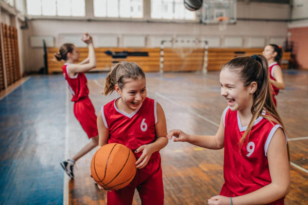 istock Basketball team playing on basketball court 1131655949