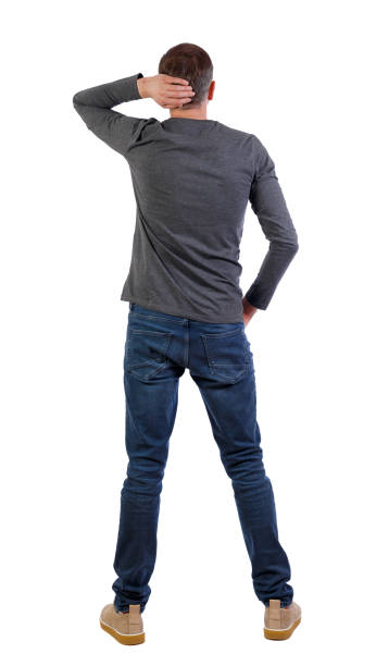 istock Back view of man in jeans. Standing young guy. 1131656498