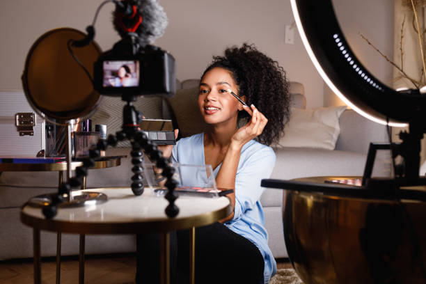 istock Beauty vlogger applying cosmetics on eyes in home 1131657087