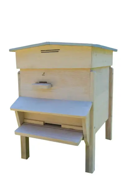 Beekeeping. Wooden beehive for bees on honeycombs. On a white background.