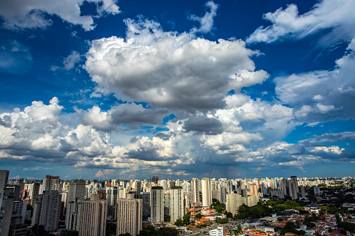 Amazing view over a city, the city of Sao Paulo Brazil. Big White clouds at sky.