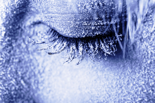 Frozen woman's eye covered in frost