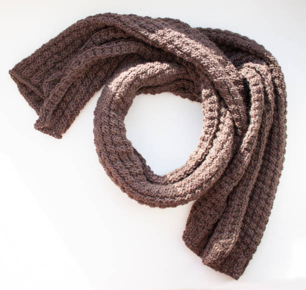 istock Brown knitted scarf on white background 1131675526