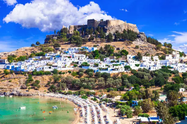 Photo of Rhodes island - popular Lindou bay with Acropolis castle. Landmarks of Greece