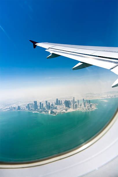 istock Bird's eye view on modern city under the plane wing 113167655