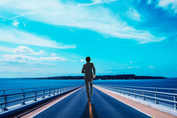 istock Businessman walking a straight road 1131678725