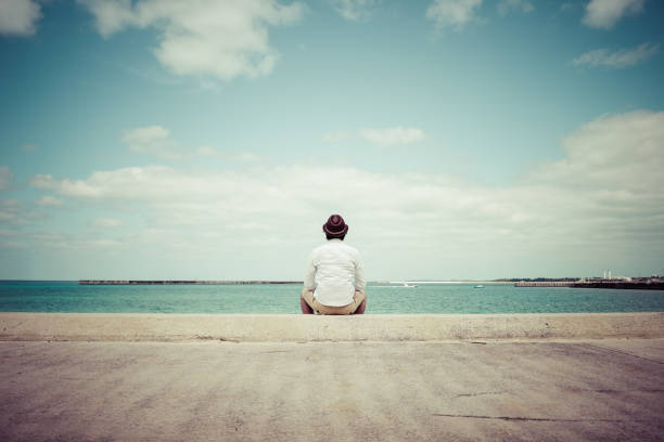 istock Men stare at the sea 1131678733