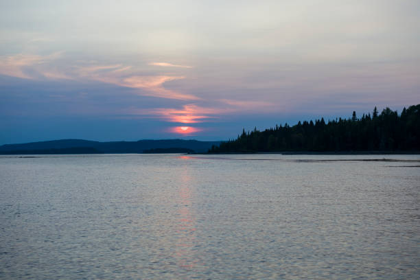 istock Twilight sunset over a lac with colorful clouds in sky 1131678736