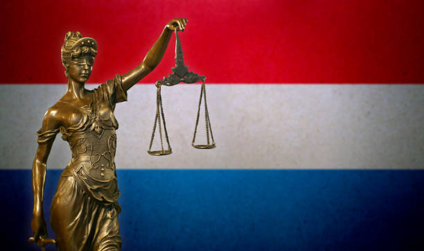 istock Lady Justice before a flag of Luxembourg 1131679786