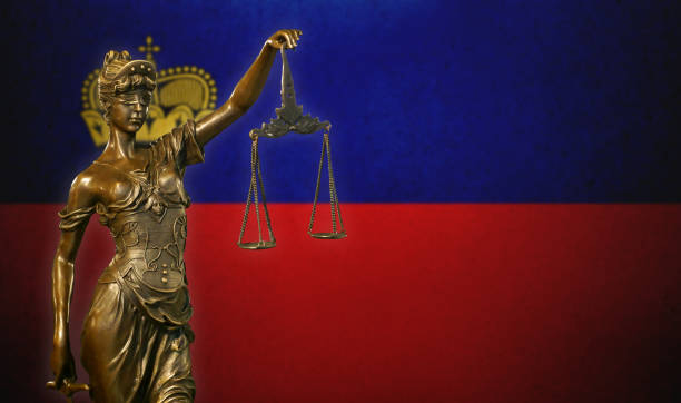 istock Lady Justice before a flag of Liechtenstein 1131681005
