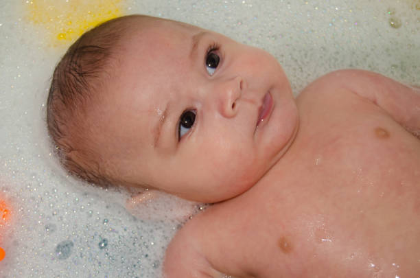 istock cute 4 months old baby boy having a bath with foam 1131682147