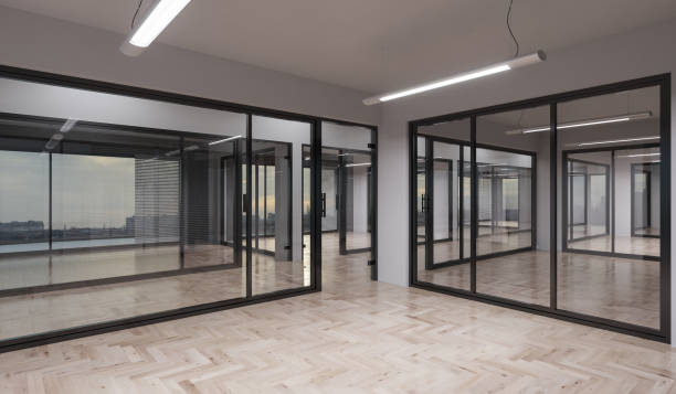 istock Illuminated Office Rooms with Glass Partitions 1131682845