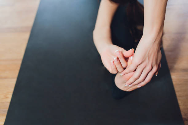 istock Young woman practicing yoga, stretching in variation of Reverse Table Top exercise, Bridge pose, working out, wearing white sportswear, indoor full length. 1131684993