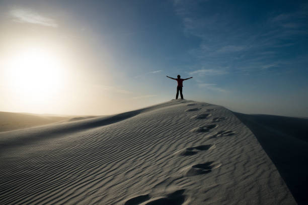 istock Man on top of dune White Sands NM 1131686818