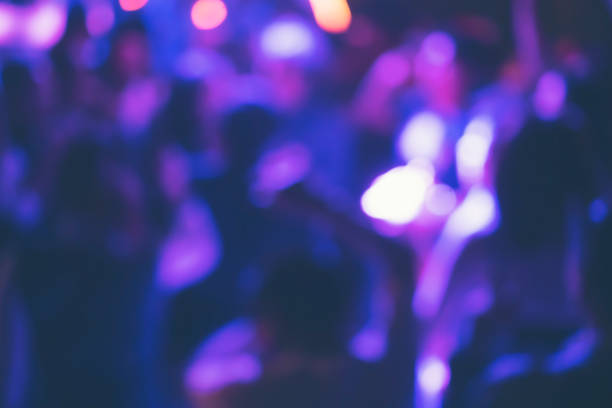 istock abstract blurry background, Drinkers are dancing in a pub party. 1131690179
