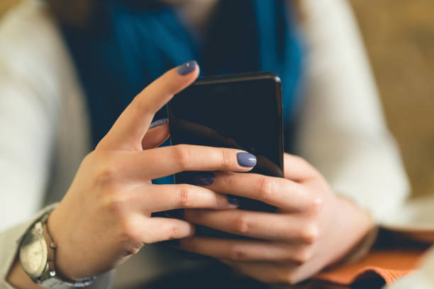 istock Close up on woman's hands holding smartphone 1131690246