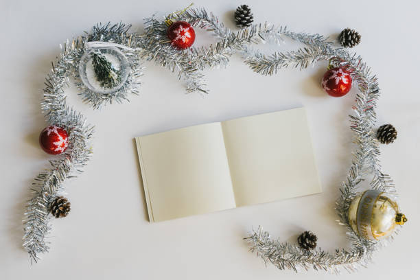 istock Christmas concept with empty blank book with Christmas decorations on white background. 1131691749