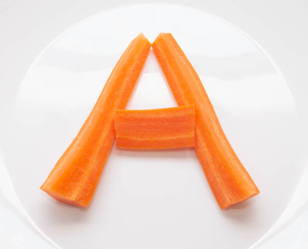 istock letter A from strips of natural fresh carrots, vitamin A 1131692877