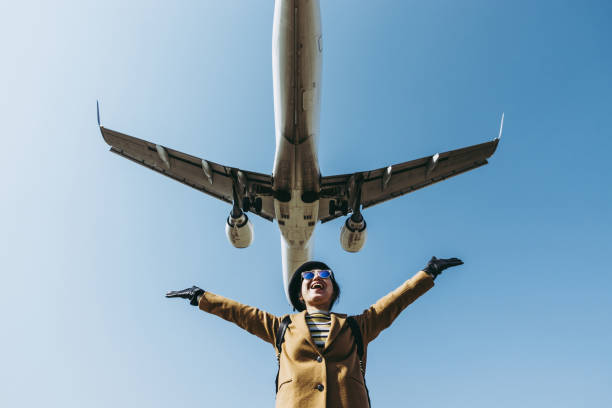 istock Asian woman and airplane 1131696062