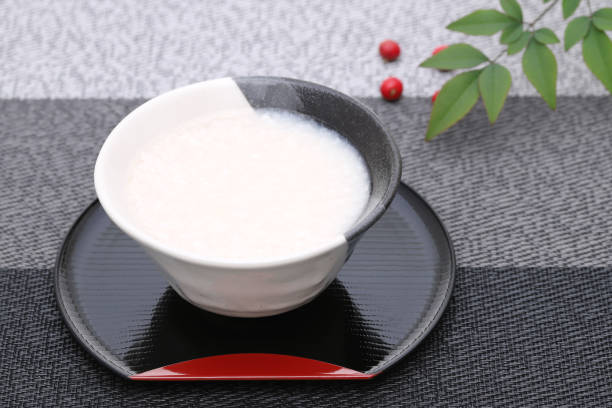 Drink of Japanese sweet alcohol drink Drink of Japanese sweet alcohol drink made from sake lees (amazake) barberry family photos stock pictures, royalty-free photos & images