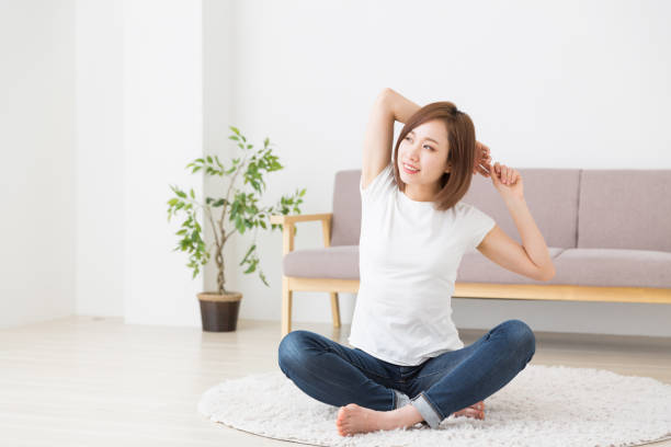運動女性 - relaxation exercise stretching exercising women ストックフォトと画像