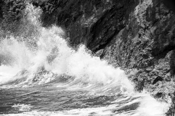 istock Waves Crashing on Volcanic Rock of Hawaii 1131701116