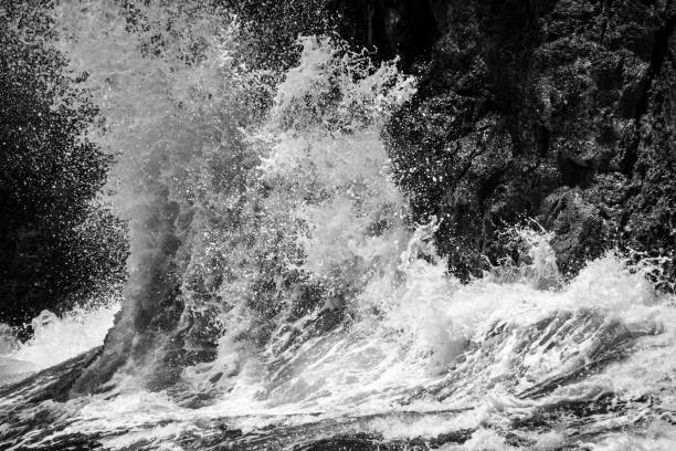 istock Waves Crashing on Volcanic Rock of Hawaii 1131701820