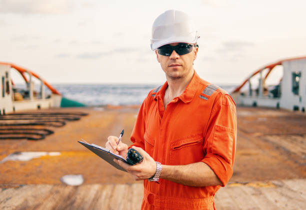 istock chief officer on deck of ship or vessel with checklist 1131701845