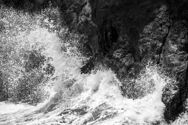 istock Waves Crashing on Volcanic Rock of Hawaii 1131702090