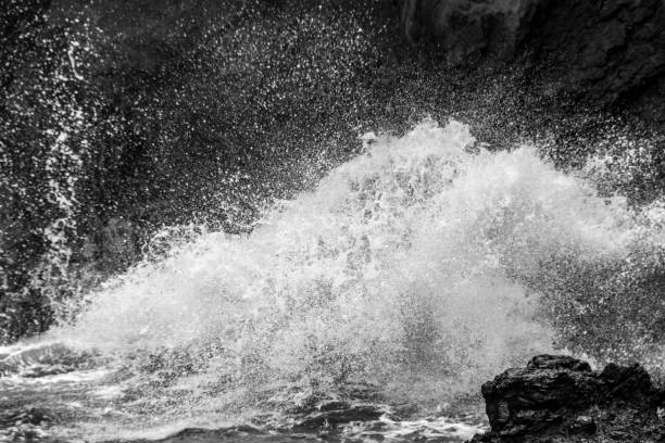 istock Waves Crashing on Volcanic Rock of Hawaii 1131702693