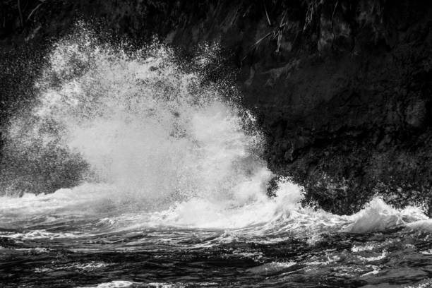 istock Waves Crashing on Volcanic Rock of Hawaii 1131703573