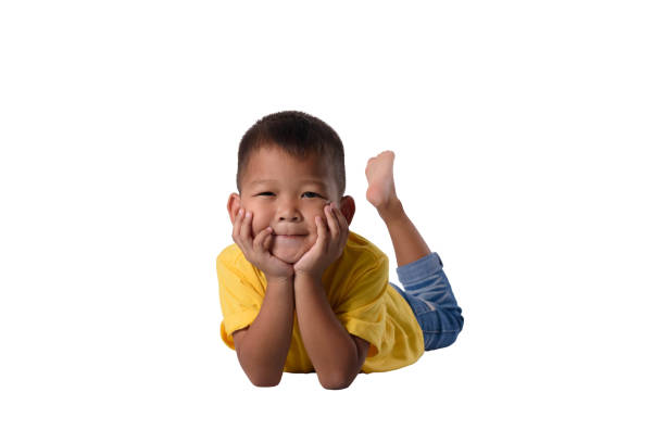 istock happy asian children lying on floor isolated white background 1131705926