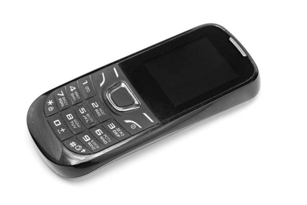 istock Push-button phones of the older generation on isolated background . Mobile technology development 1131707628