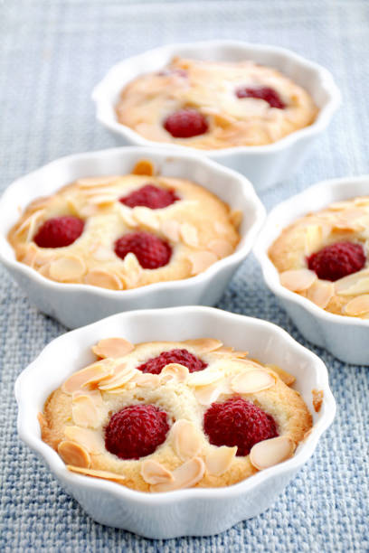 Almond raspberry financiers Lovely French almond raspberry financiers originated at a bakery in the financial district of Paris many years ago.  Made of ground almonds, flour, sugar and egg whites. almond slivers stock pictures, royalty-free photos & images