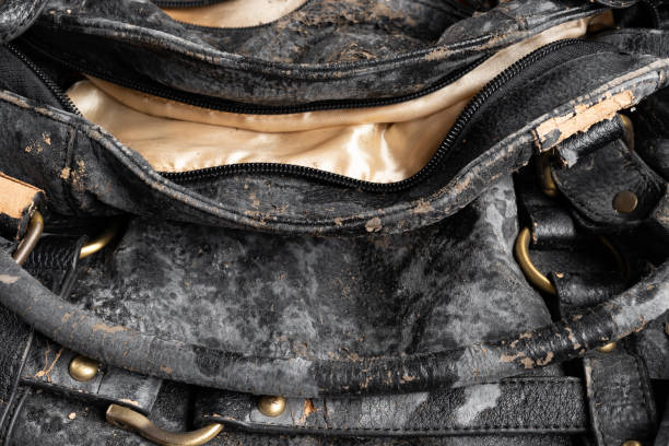 moldy leather bag on dark background close up stock photo