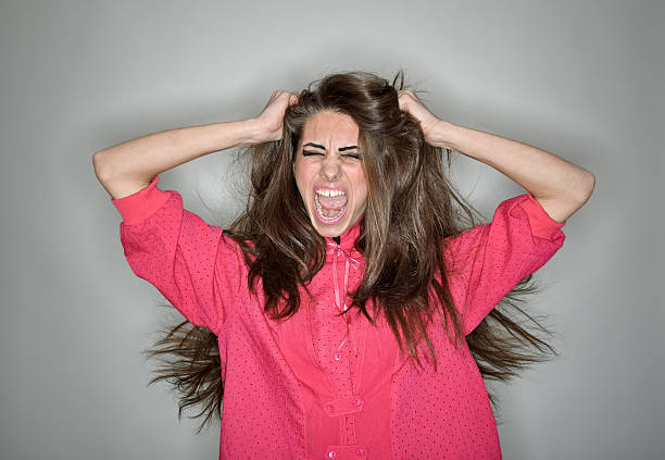 istock Screaming aggressive brunette woman dressed in pink blouse 113172414