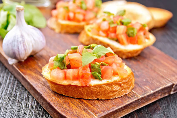 istock Bruschetta with tomato and spinach on board 1131724142