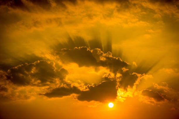 istock sunset light on golden sky and cloud background 1131725448