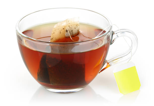 istock Tea in a glass cup isolated on white 1131728982