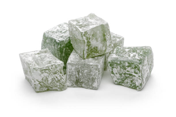 istock Green Turkish delights isolated on white 1131730498