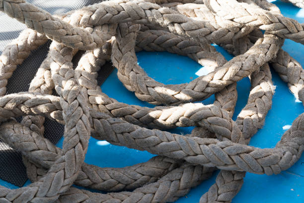 istock rope closeup on blue background. 1131731257