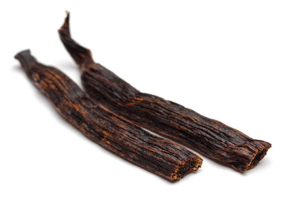 istock Vanilla bean with seeds isolated on white 1131731436