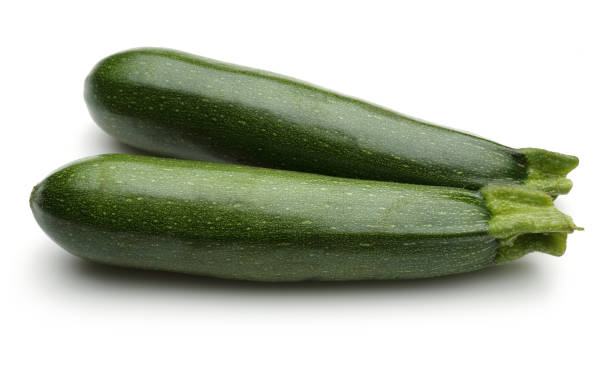 istock Two whole green zucchini isolated on white 1131732769